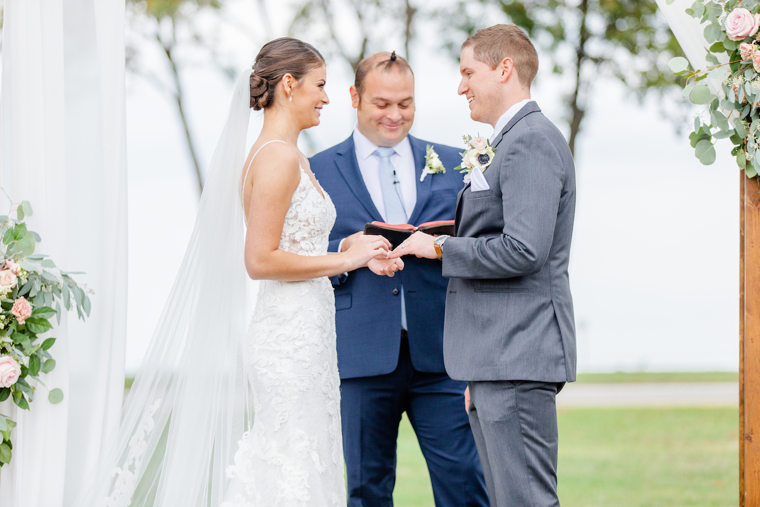 Bride and groom standing at alter for the lakehouse wedding