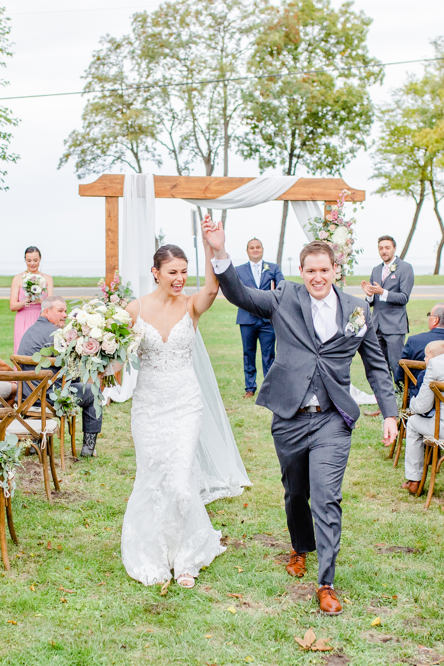 Bride and groom walking down aisle for the lakehouse wedding