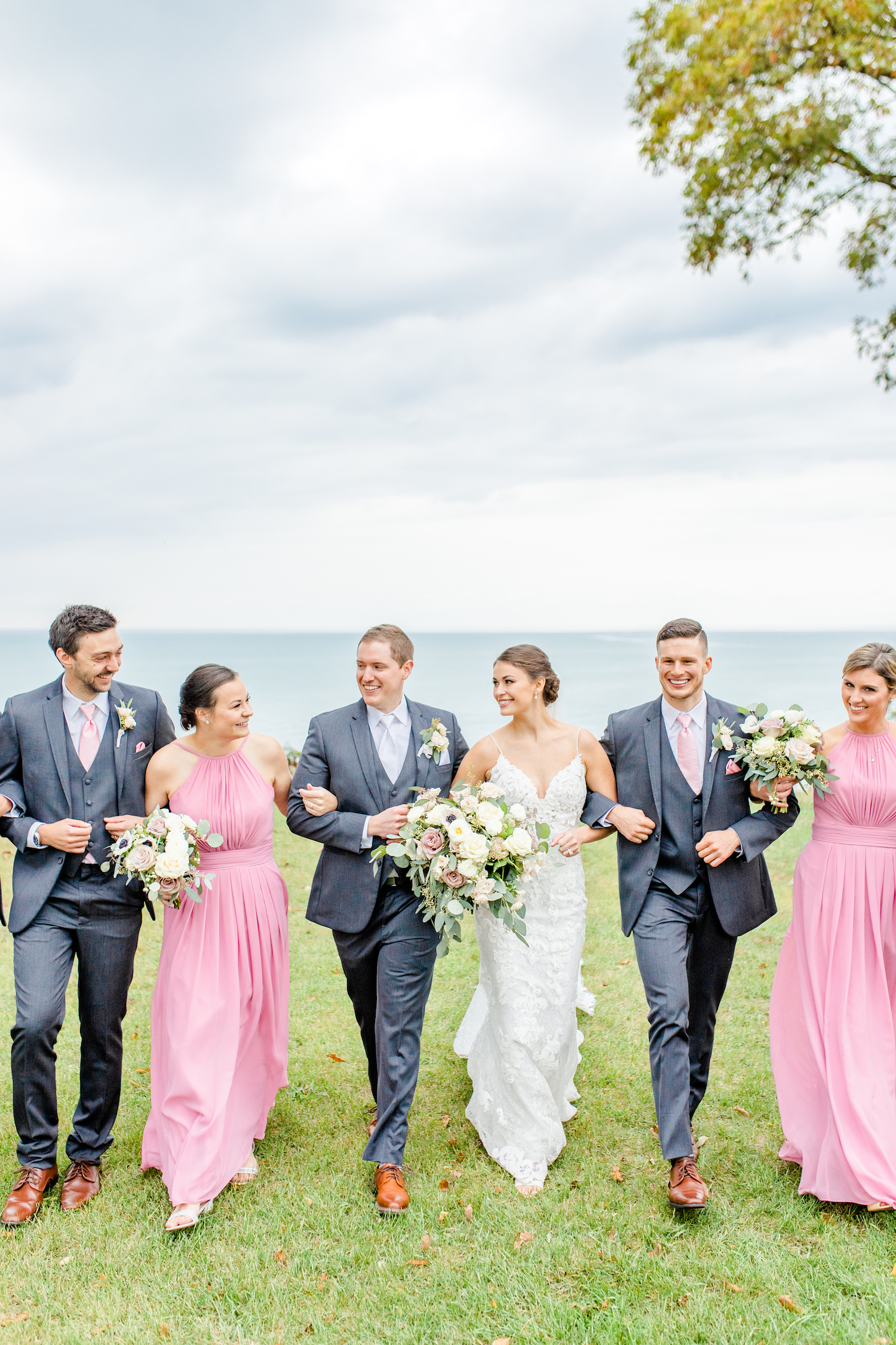 Bridal party walking at the lakehouse wedding