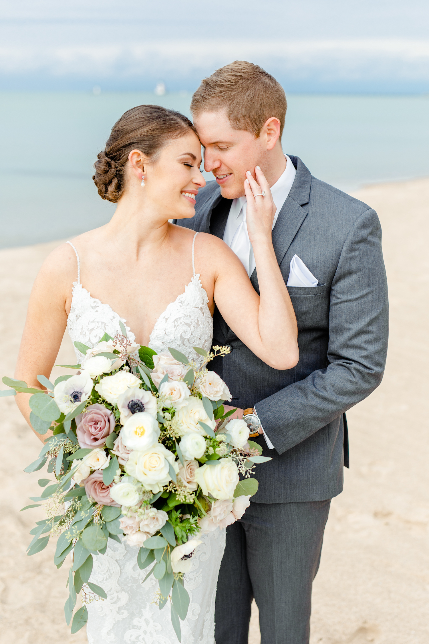 Bride and groom smiling at the lakehouse wedding