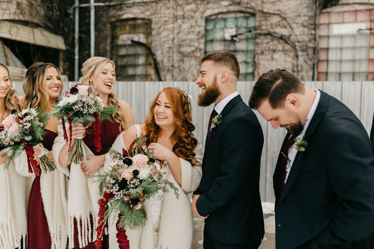 Bridal party laughing at Journeyman Distillery wedding