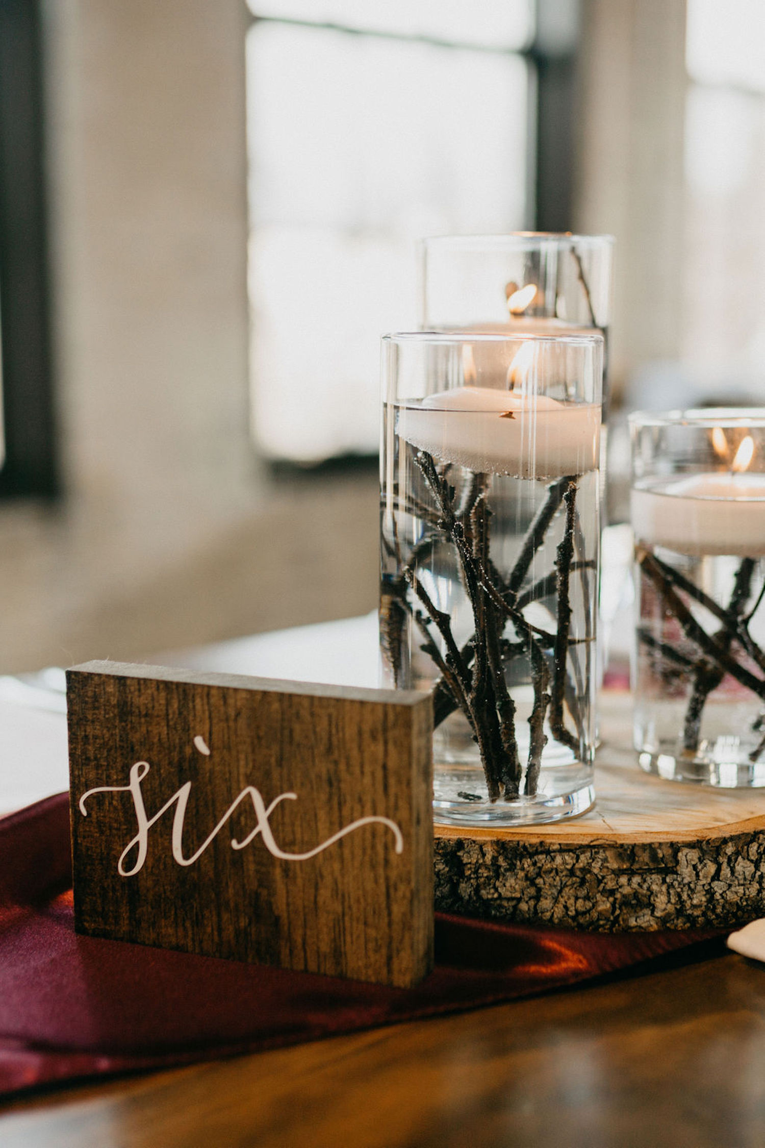 Table number and decor for Journeyman Distillery wedding