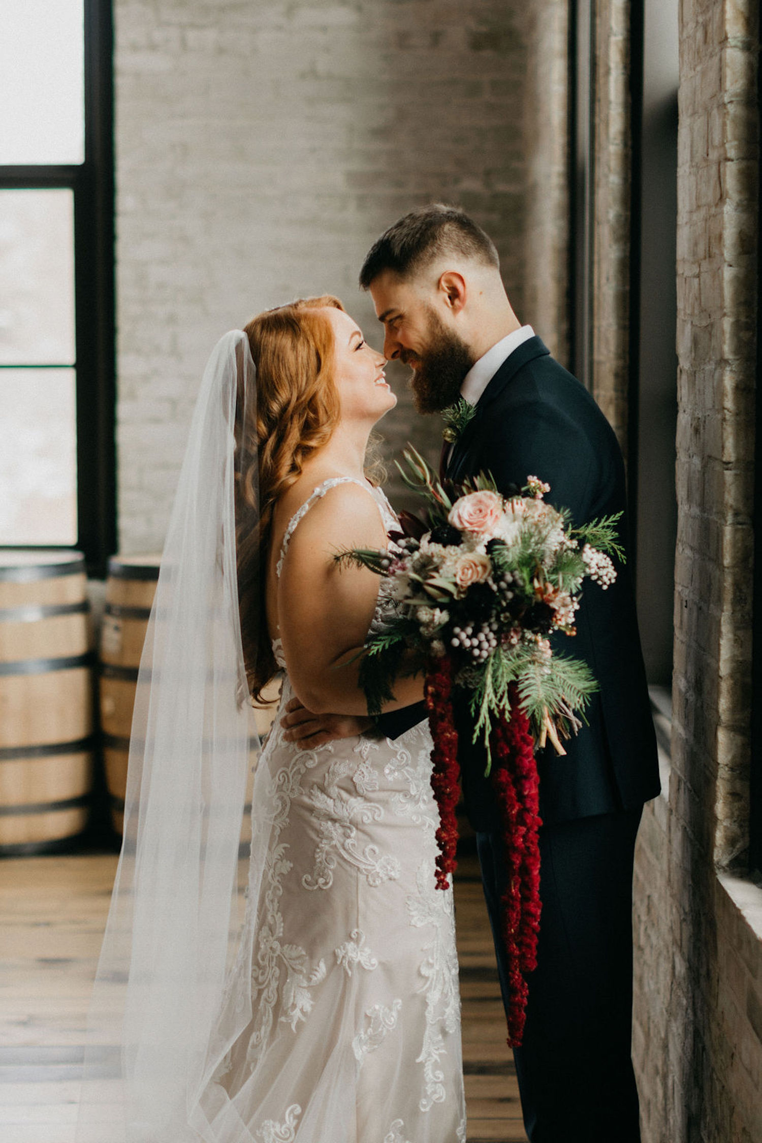Bride and groom looking at each other at Journeyman Distillery wedding