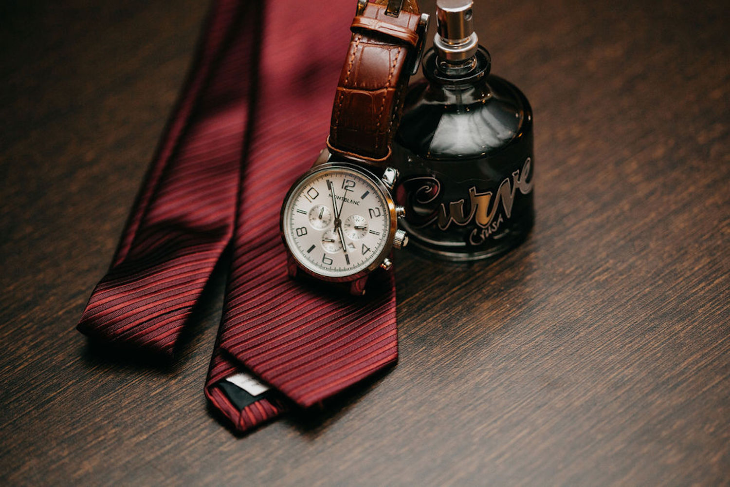Grooms tie, watch and cologne