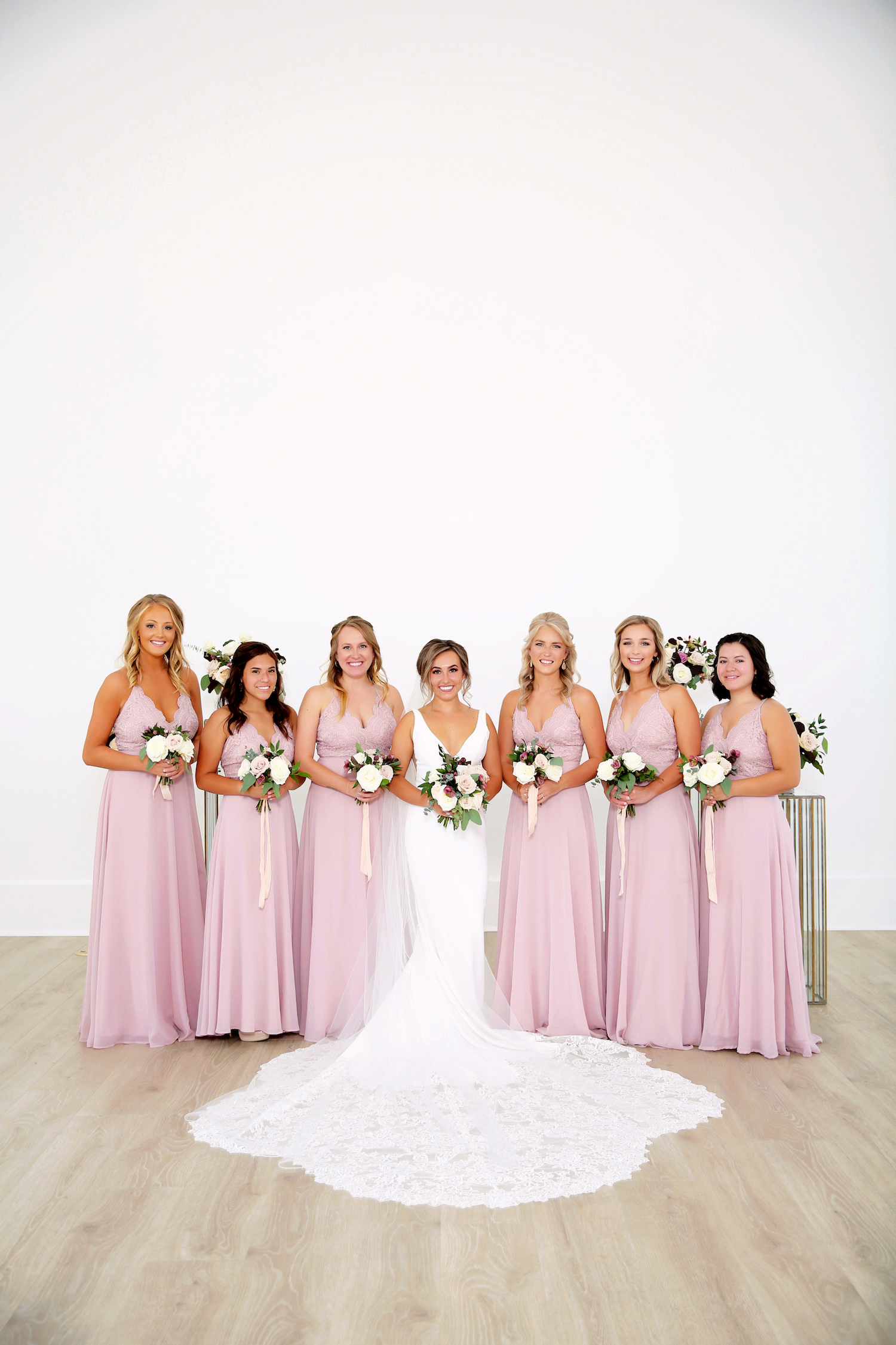 Bride standing with bridesmaids before kalamazoo michigan wedding