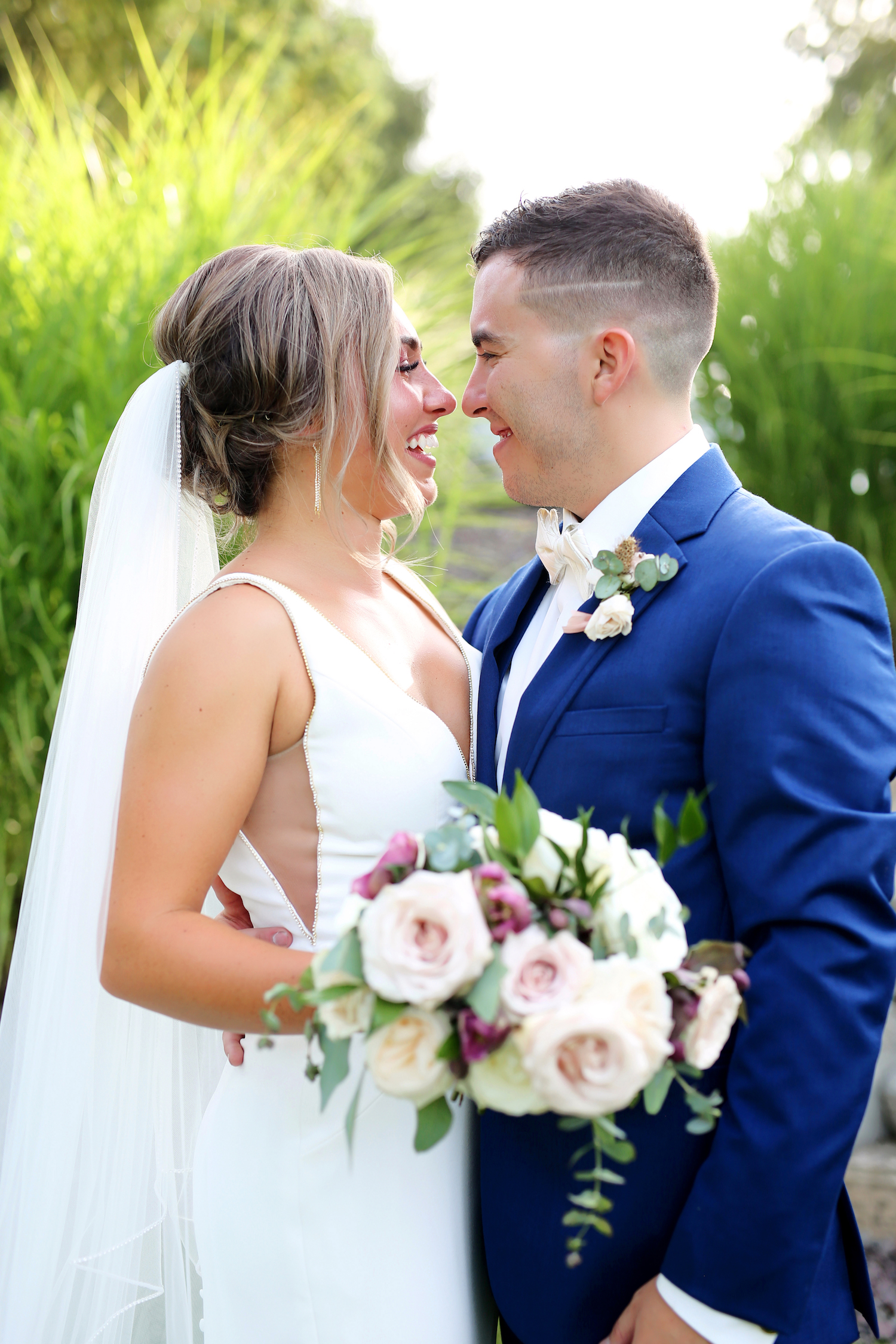 Bride and Groom smiling at each other