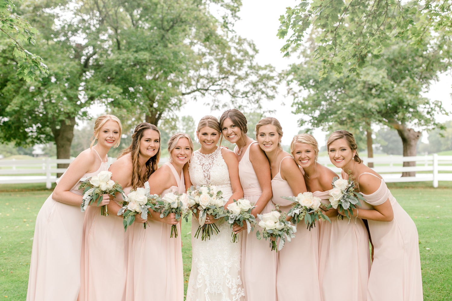 Bridesmaids standing with bride at Wallinwood Springs Golf Course wedding