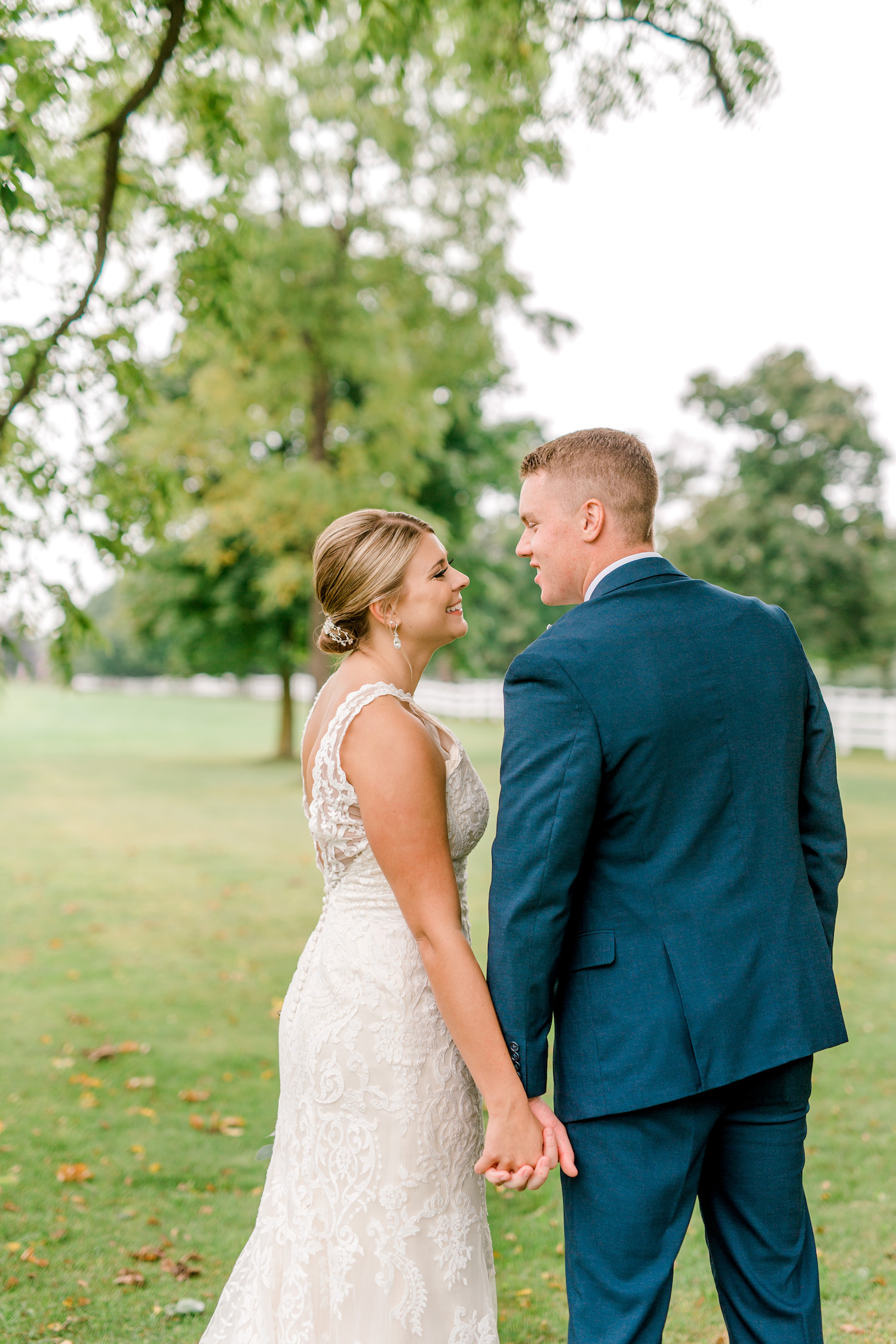 Bride and groom smiling at each other