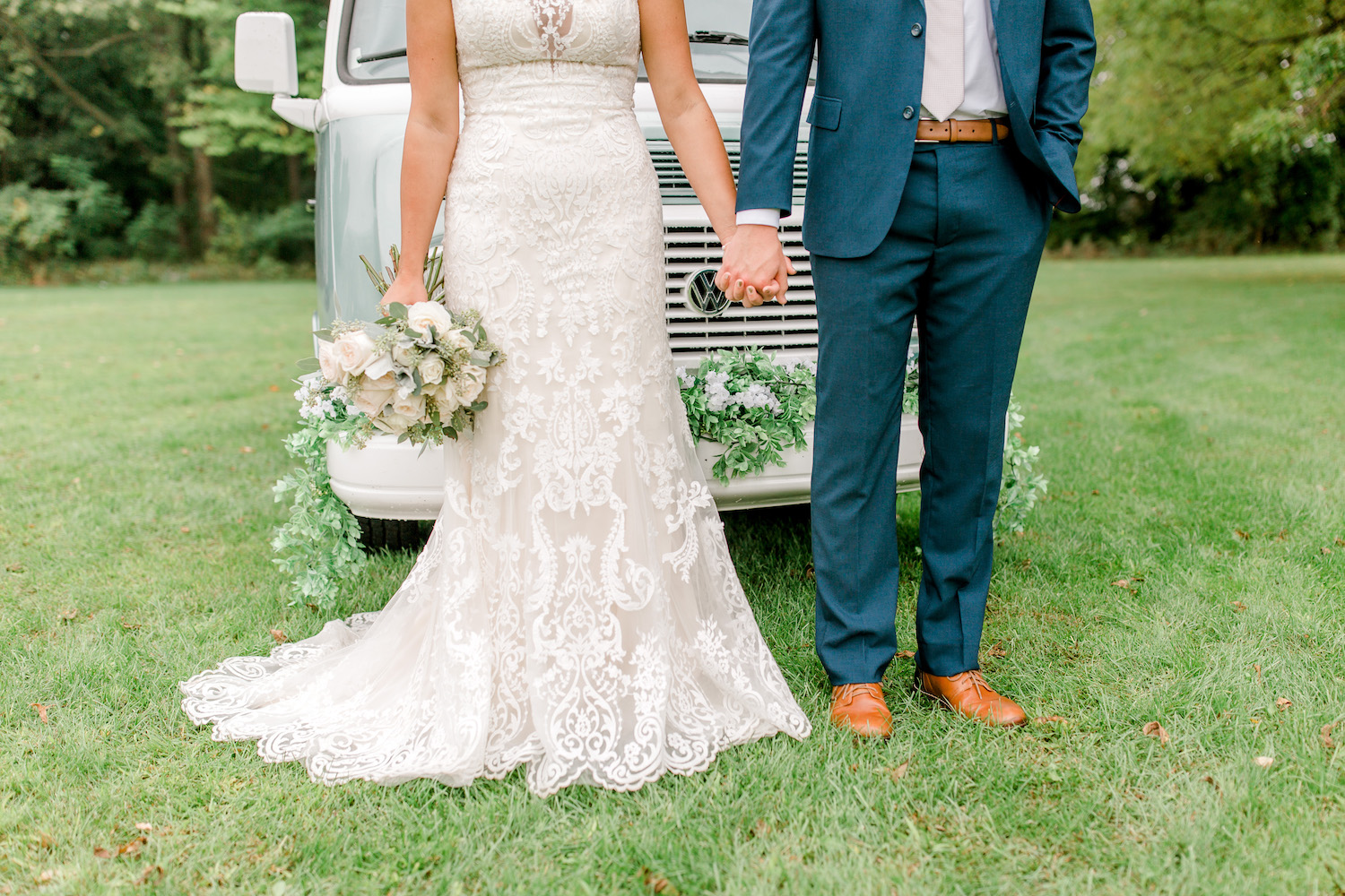 Bride and groom holding hands