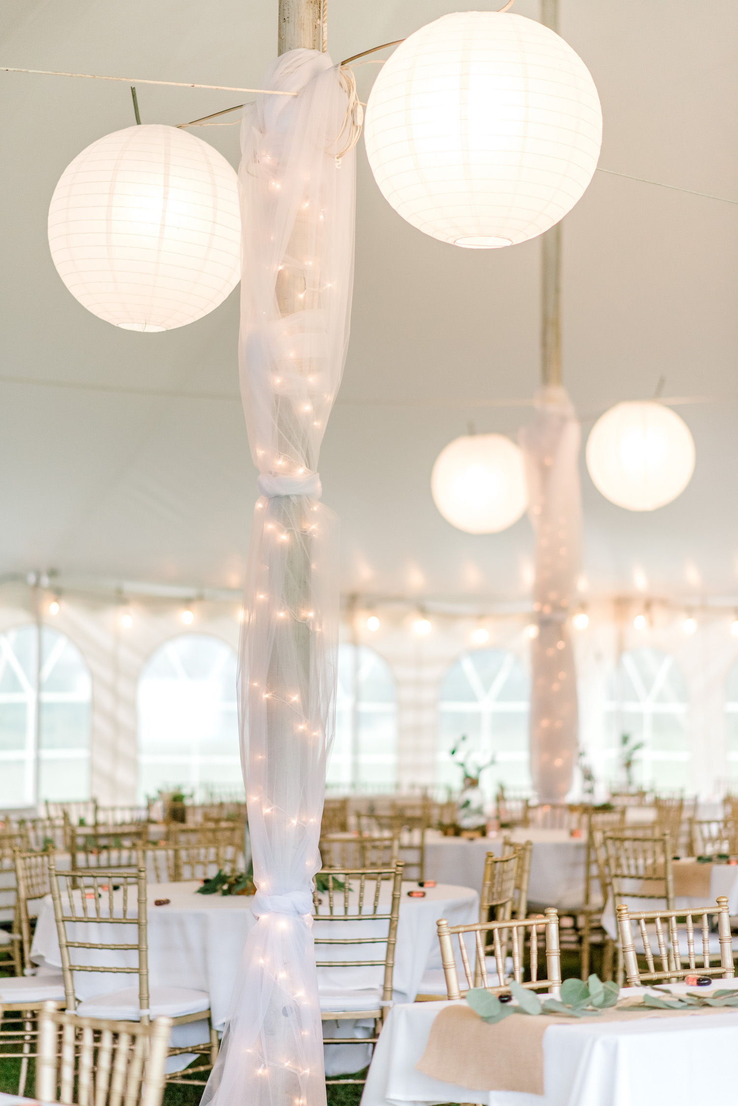 Decor under tent for Wallinwood Springs Golf Course wedding