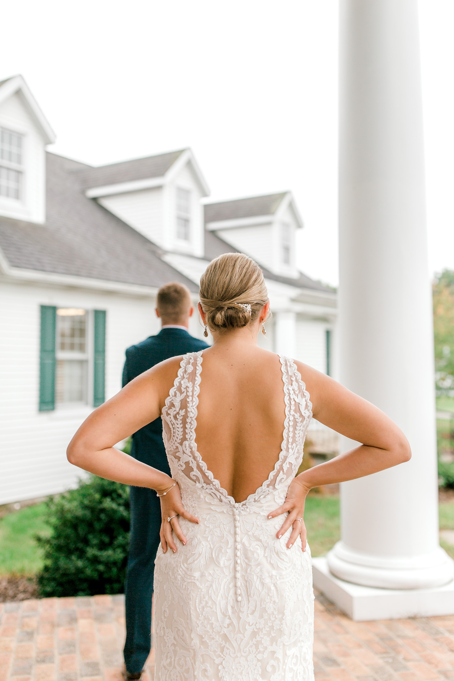 Bride standing behind her groom