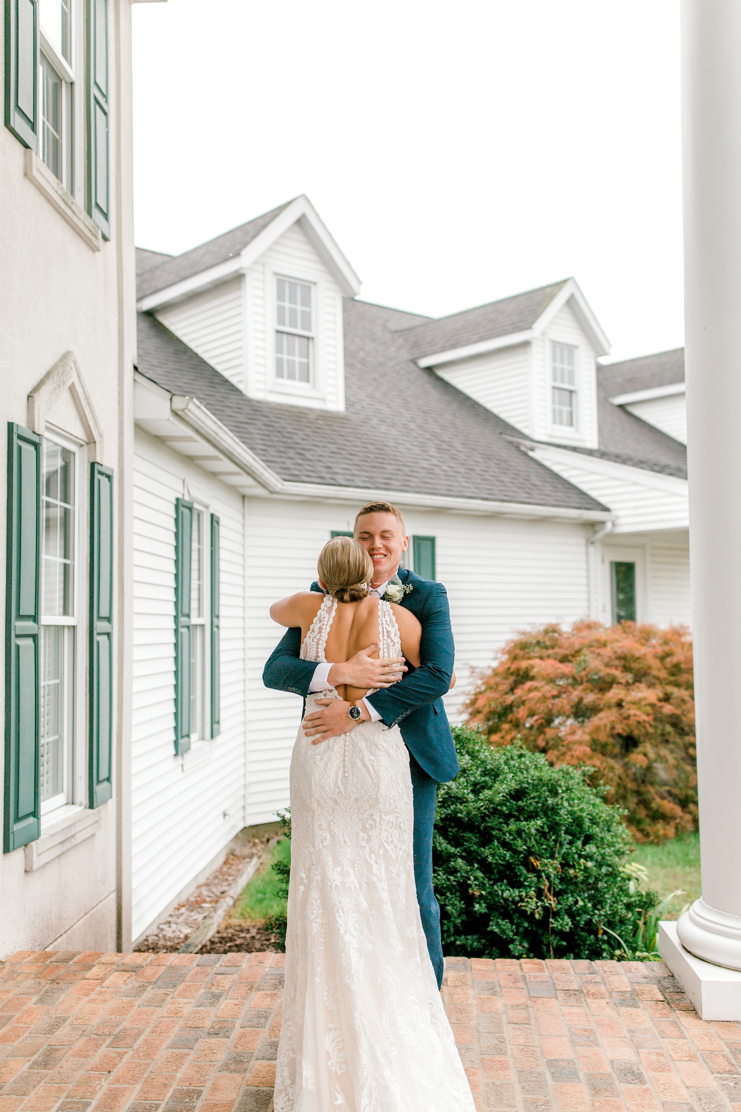 Bride and groom hugging before Wallinwood Springs Golf Course wedding