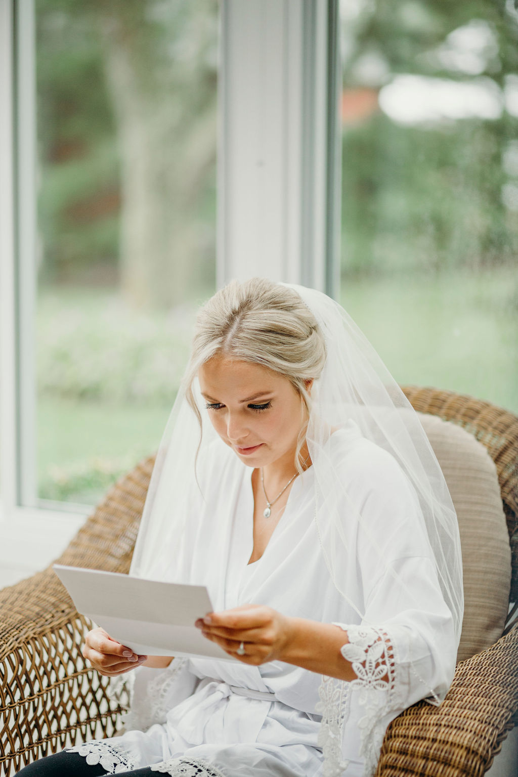 Bride reading letter before Frankfort, IL Wedding