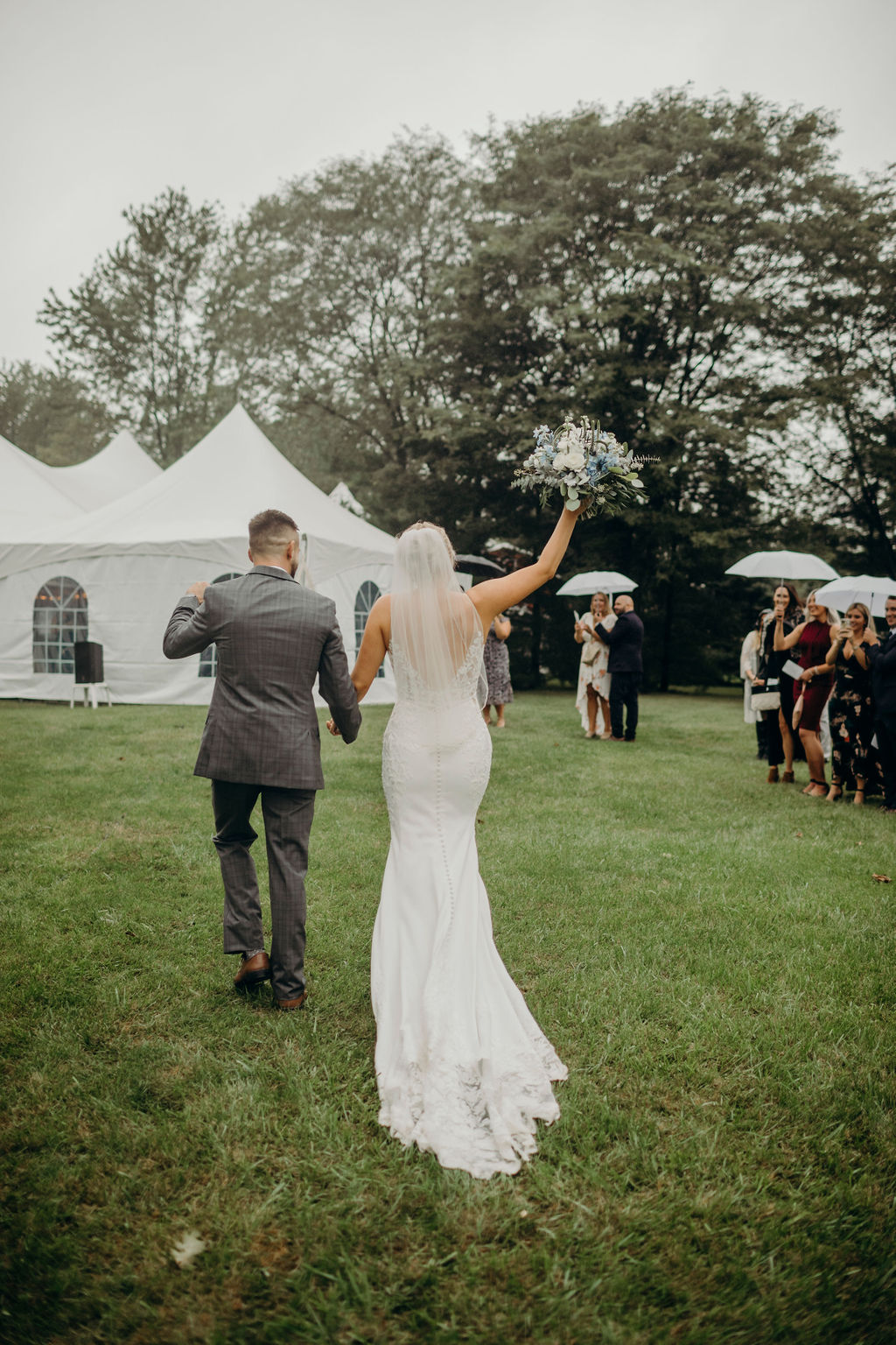 Bride and groom walking away after Frankfort, IL Wedding ceremony