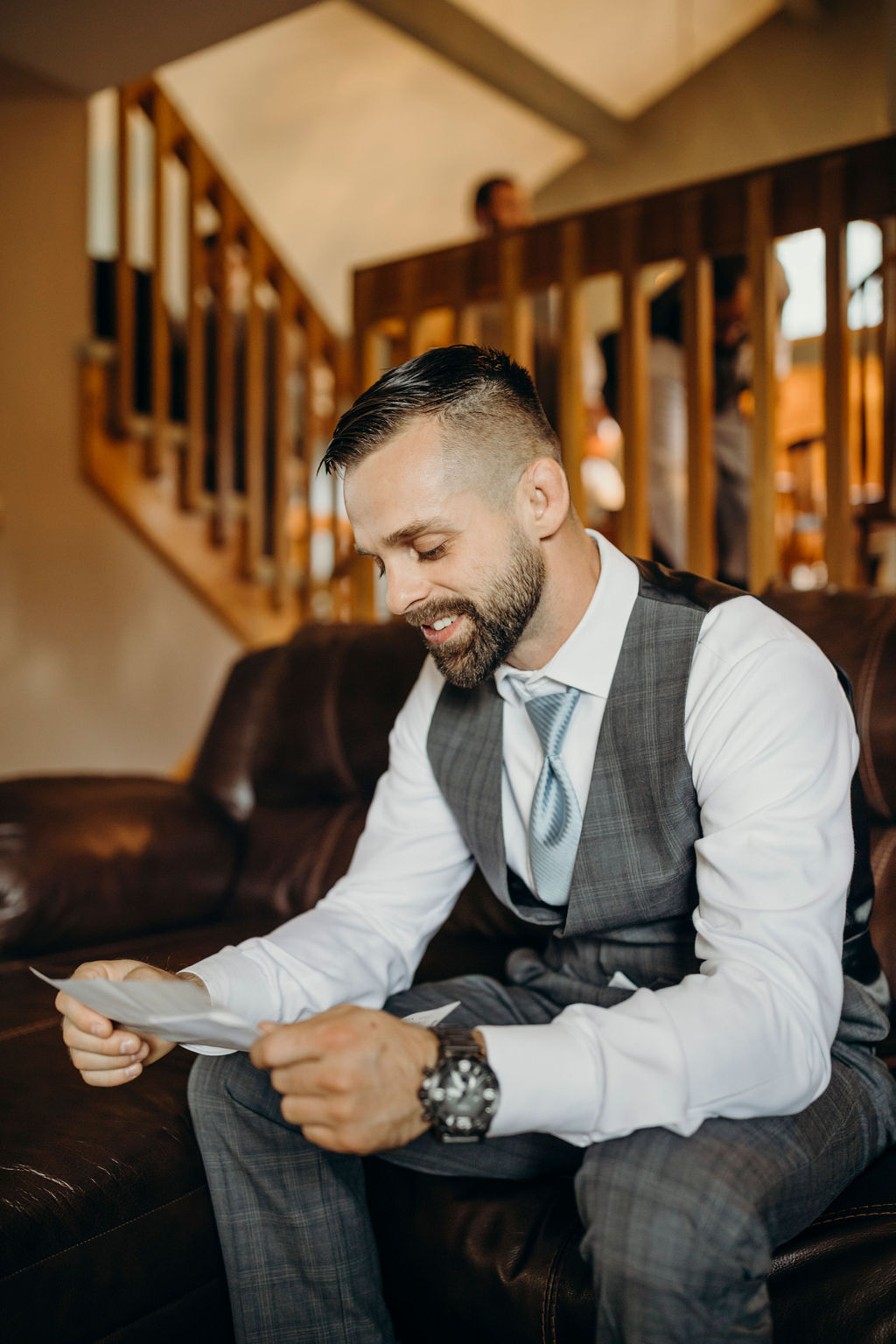 Groom reading letter on Frankfort, IL Wedding day