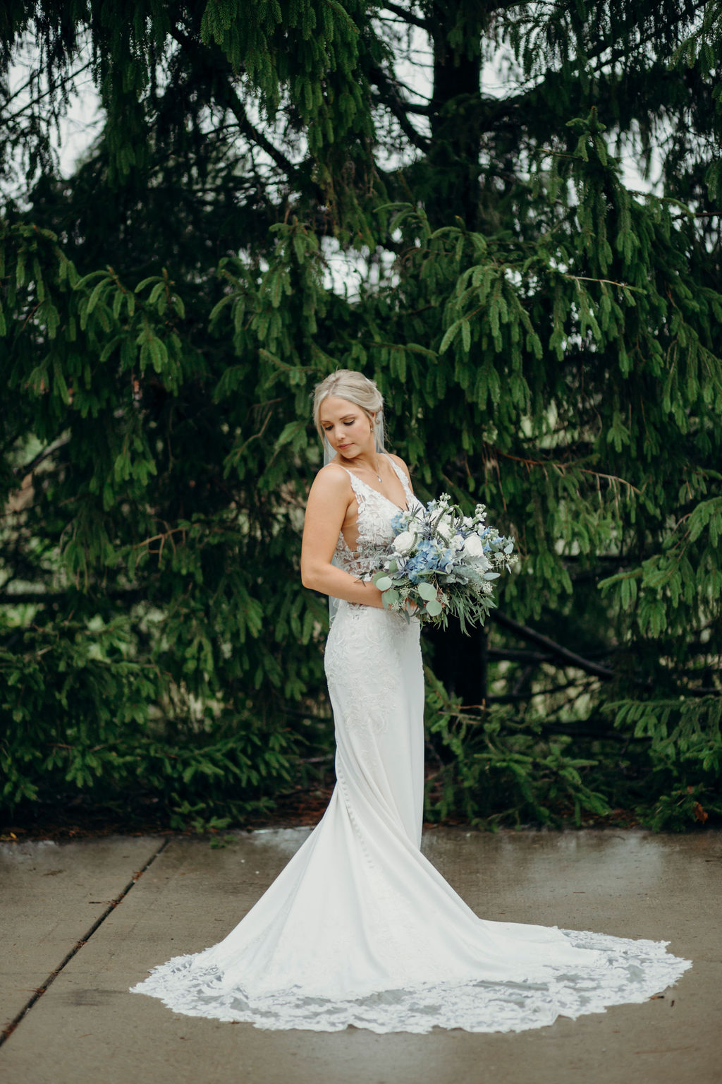 Bride standing with bouquet before Frankfort, IL Wedding