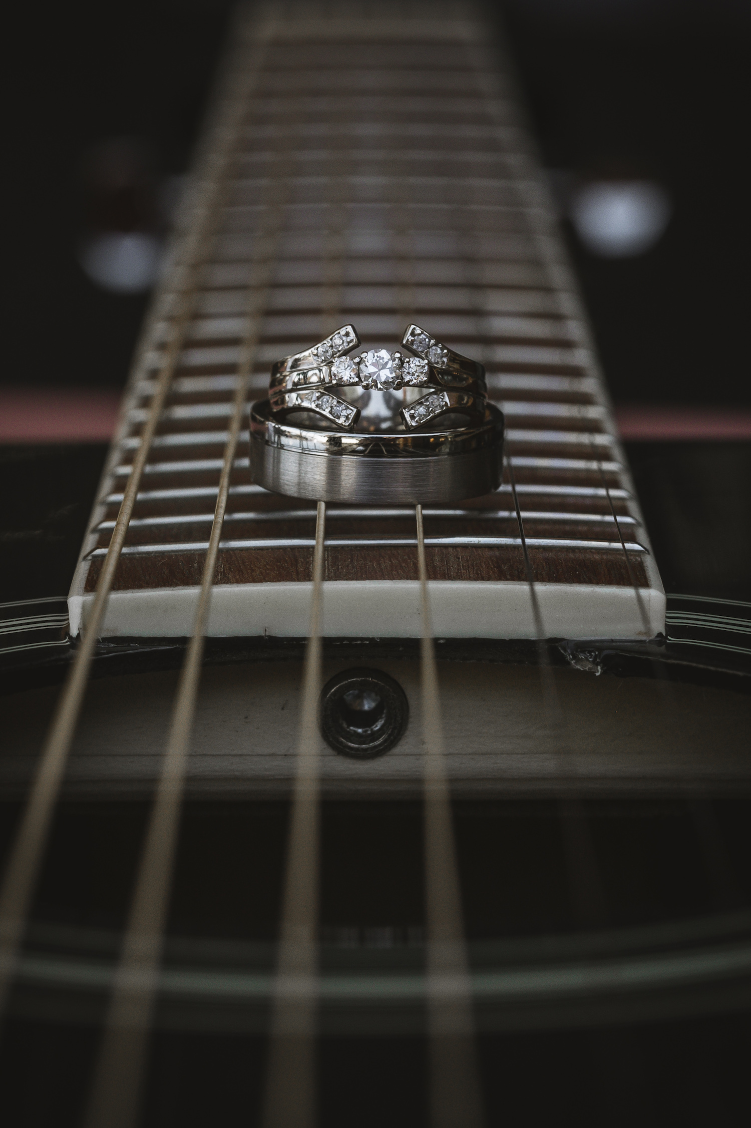 Rings laying on guitar strings