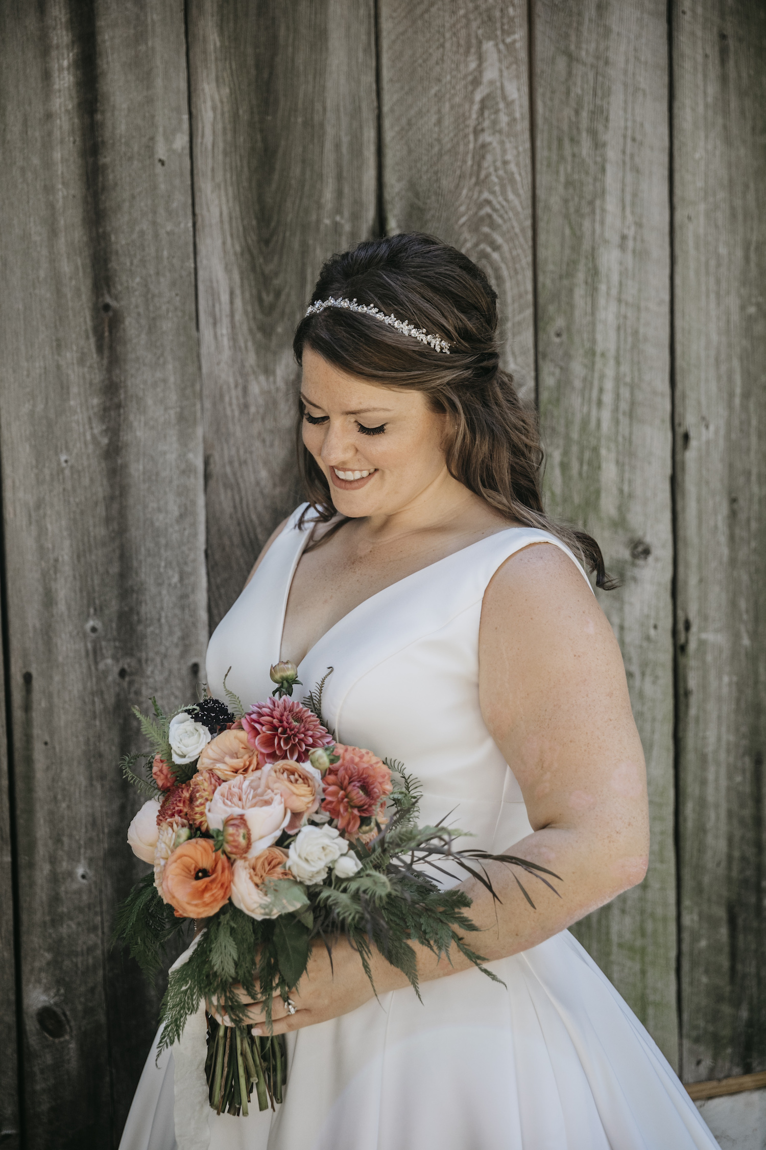 Bride smiling holding her bouquet