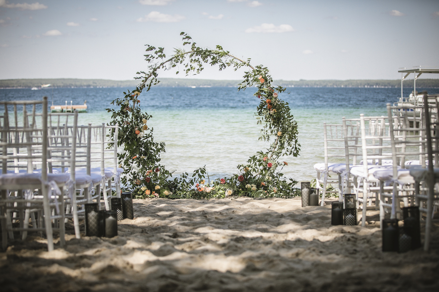 Ceremony lakeside with floral hoop
