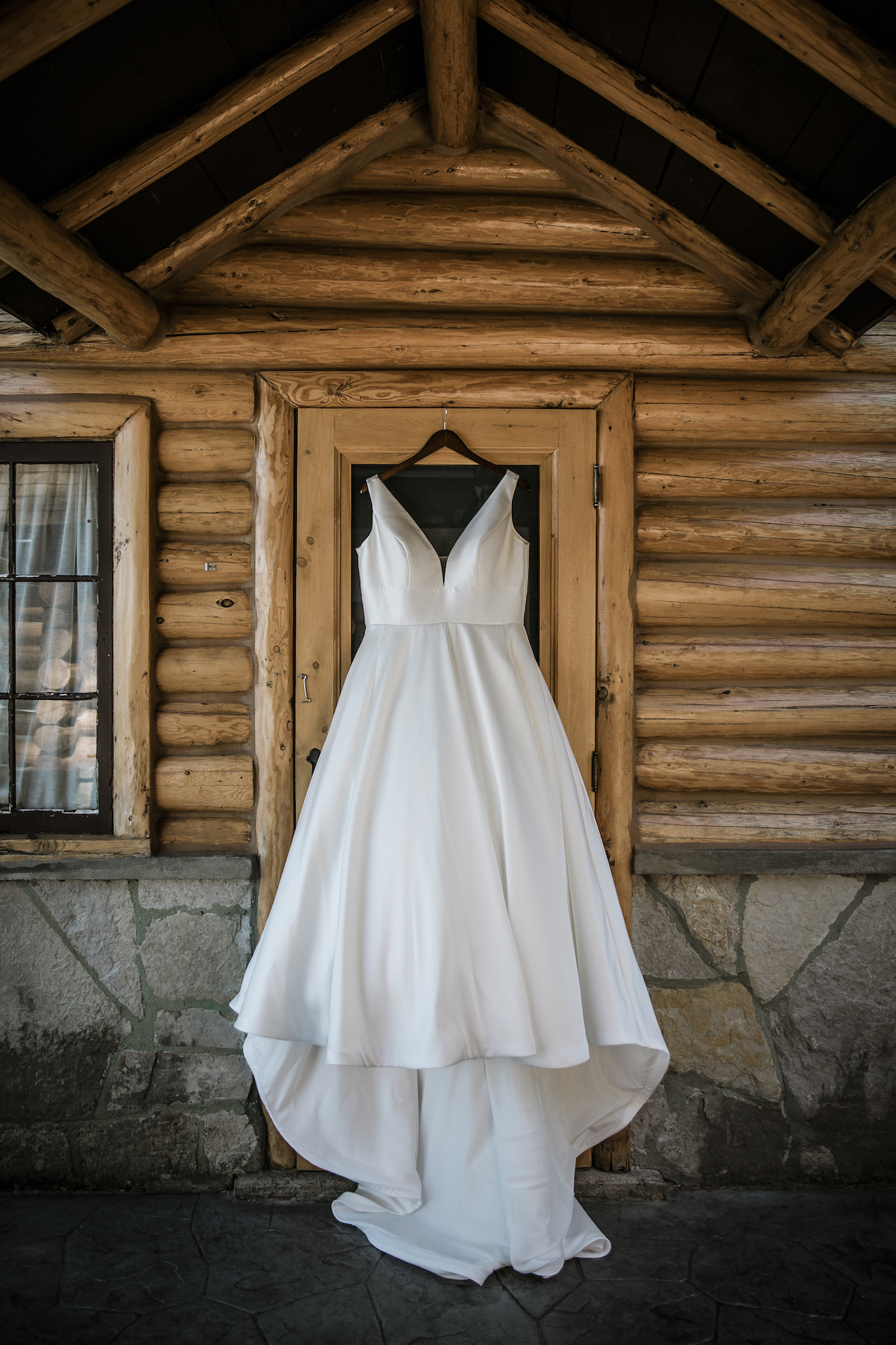 Bride's dress hanging on cabin door