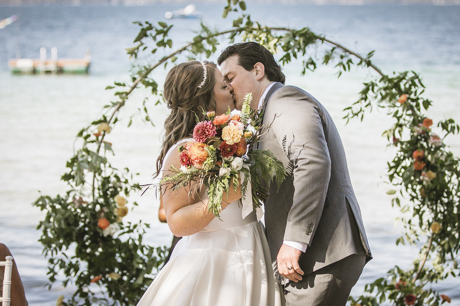 Bride and groom kissing at Higgins lake wedding
