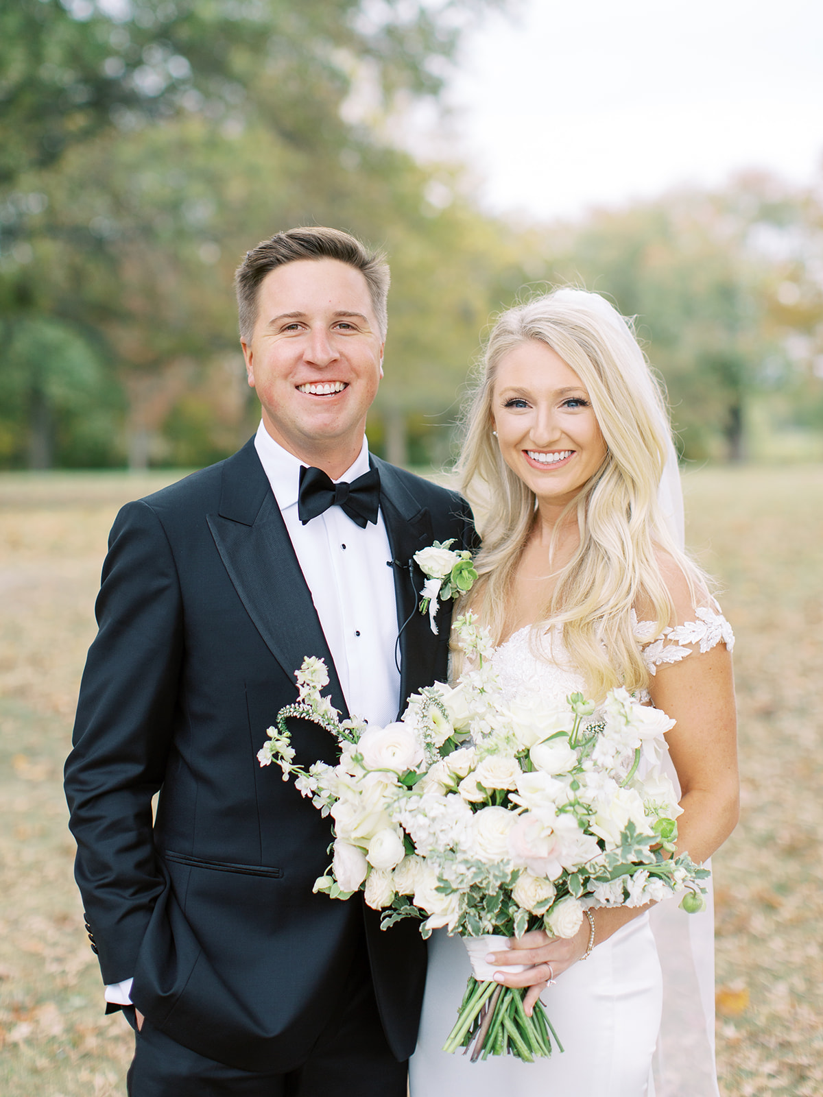 Bride and groom smiling together before Ritz Charles wedding