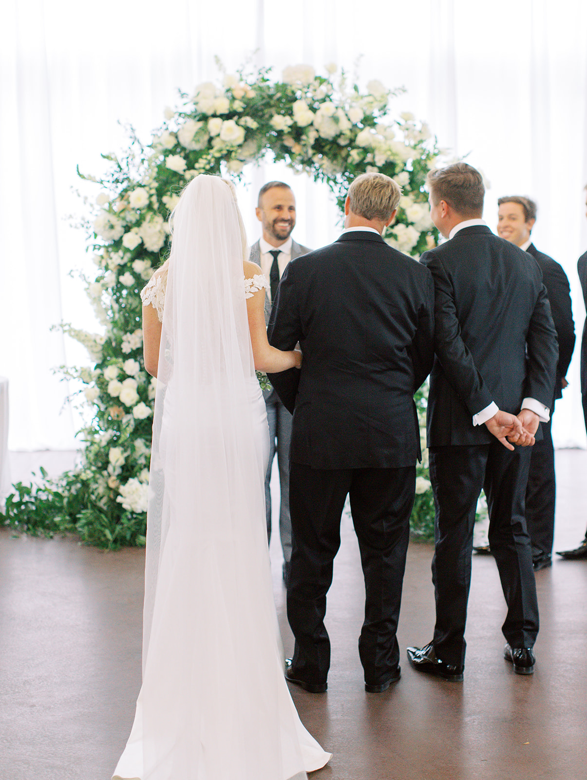 Father of bride giving her away to groom at Ritz Charles wedding