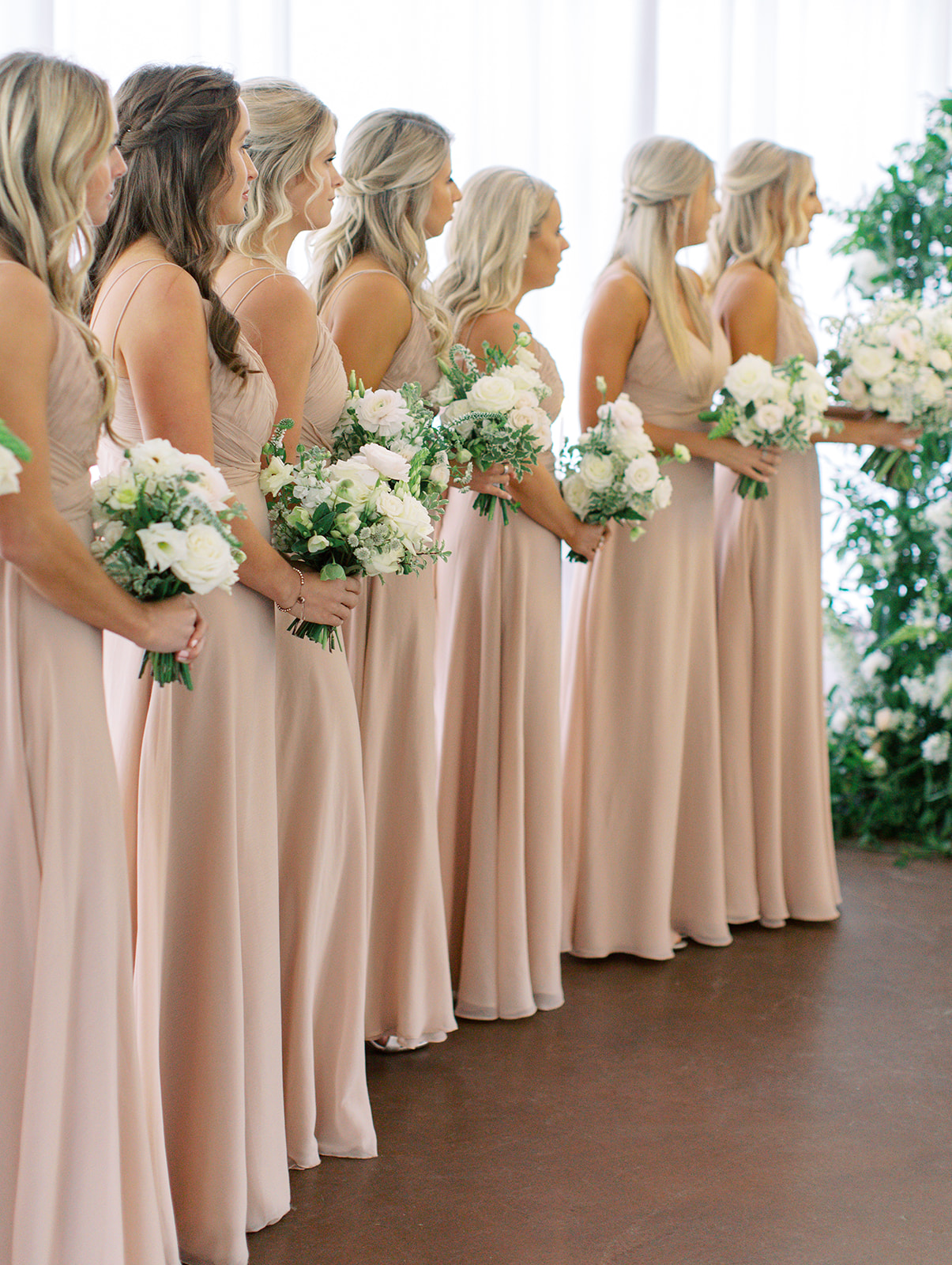 Bridesmaids holding bouquets at Ritz Charles wedding ceremony