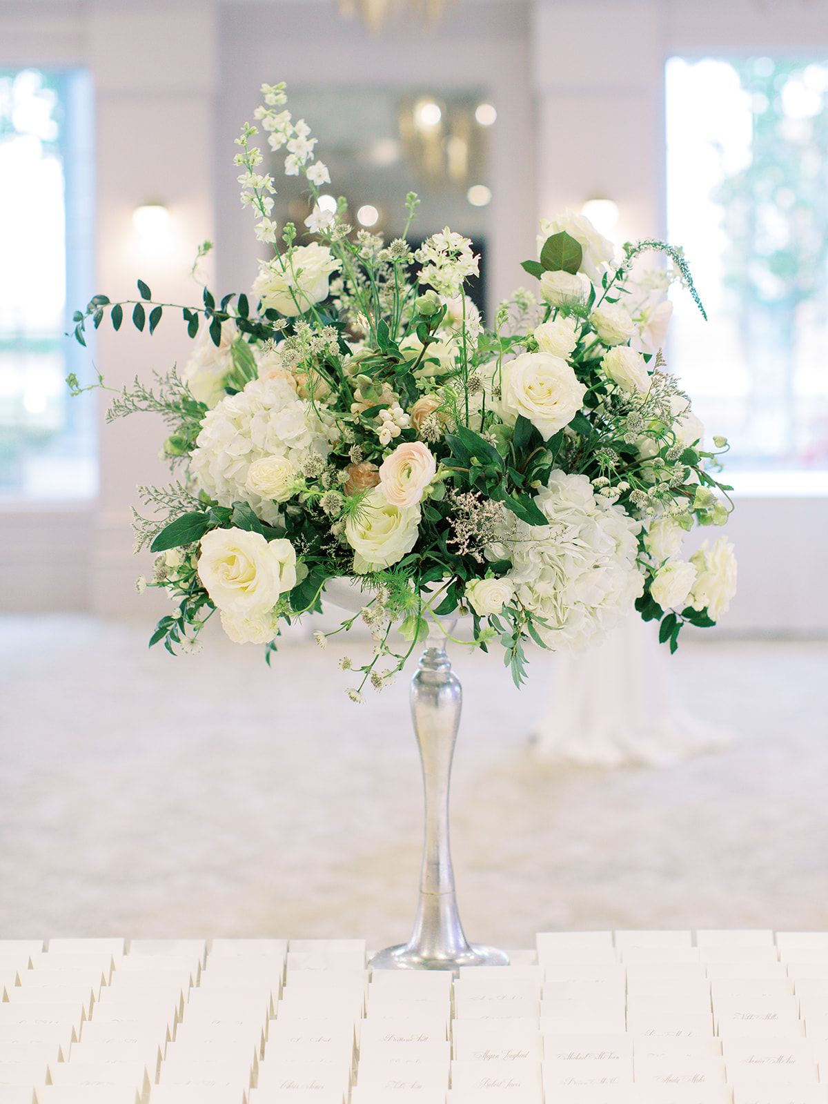 Name card display with floral bouquet