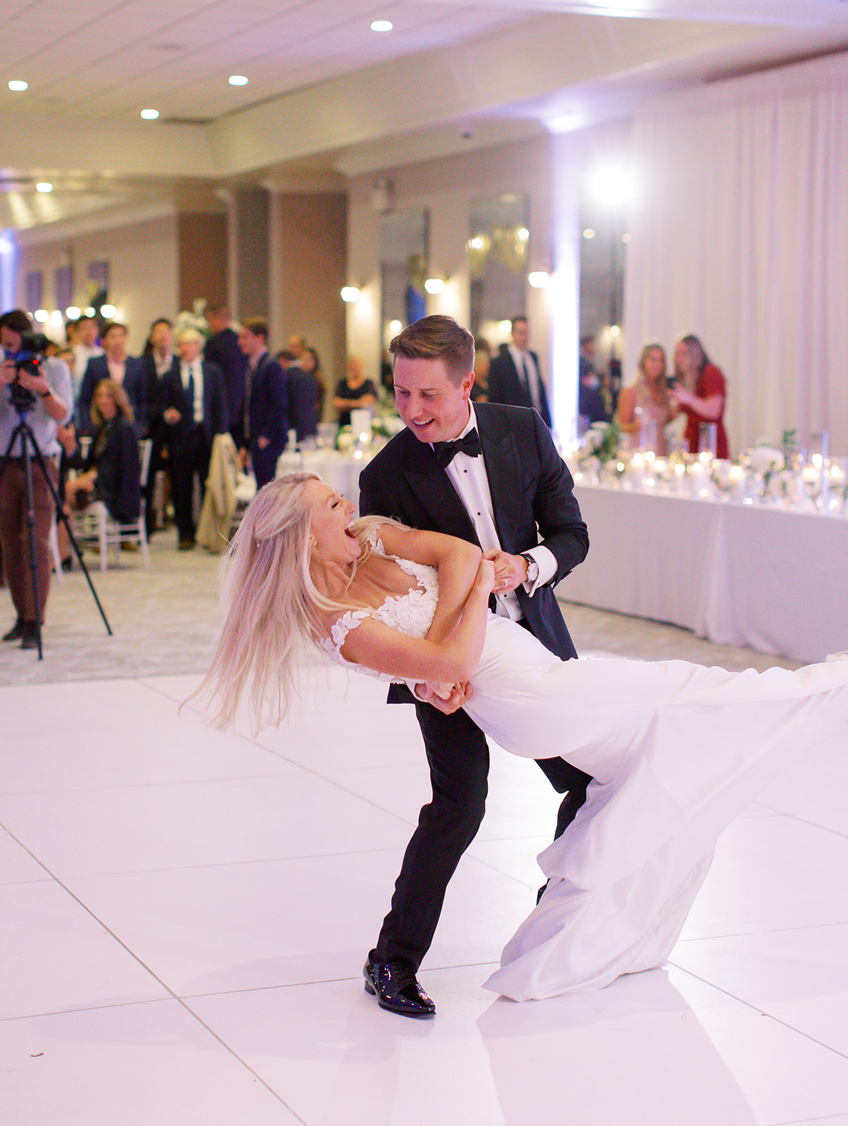 Groom dipping his bride during first dance of Ritz Charles wedding