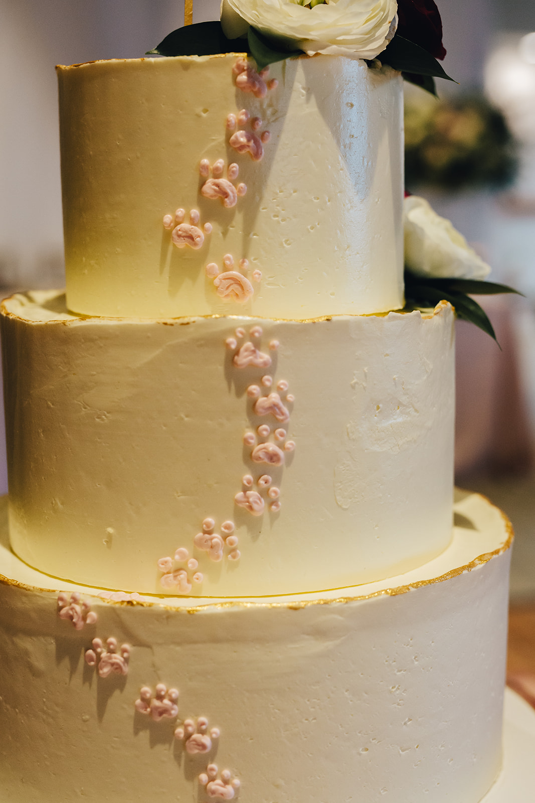 West Bay Beach wedding cake with paw prints on the side