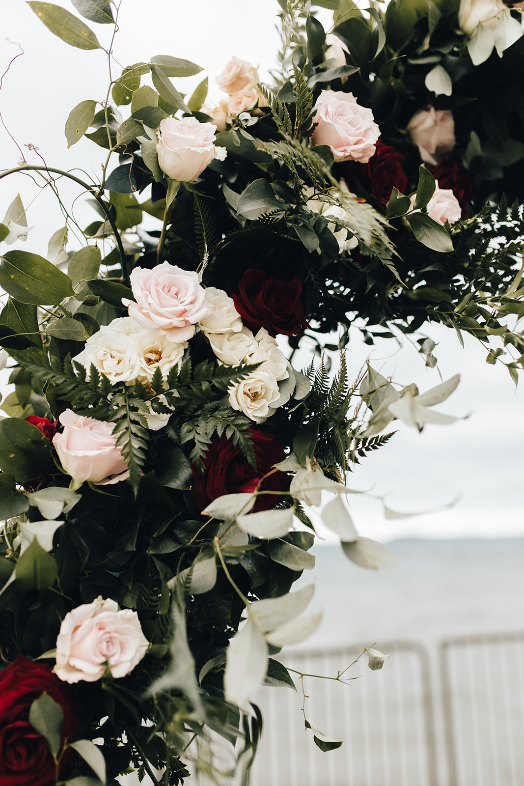 Floral decor on archway of West Bay Beach wedding
