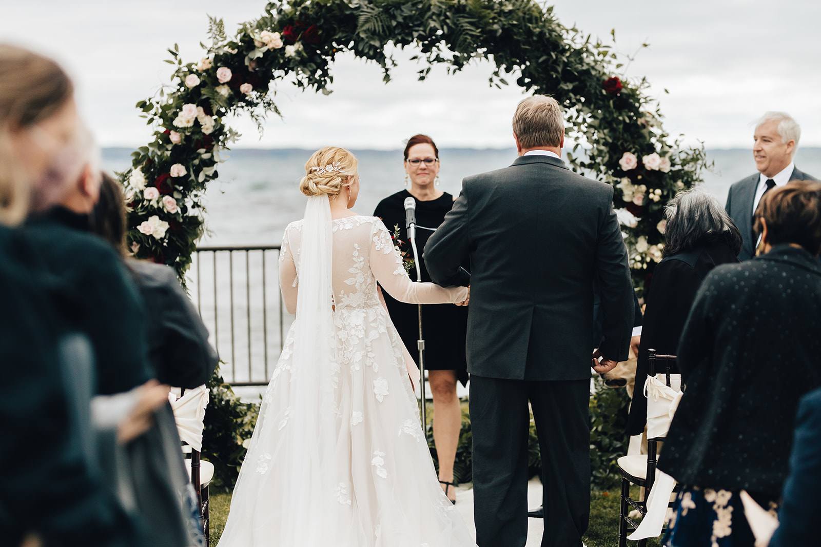 Father of bride giving her away to groom