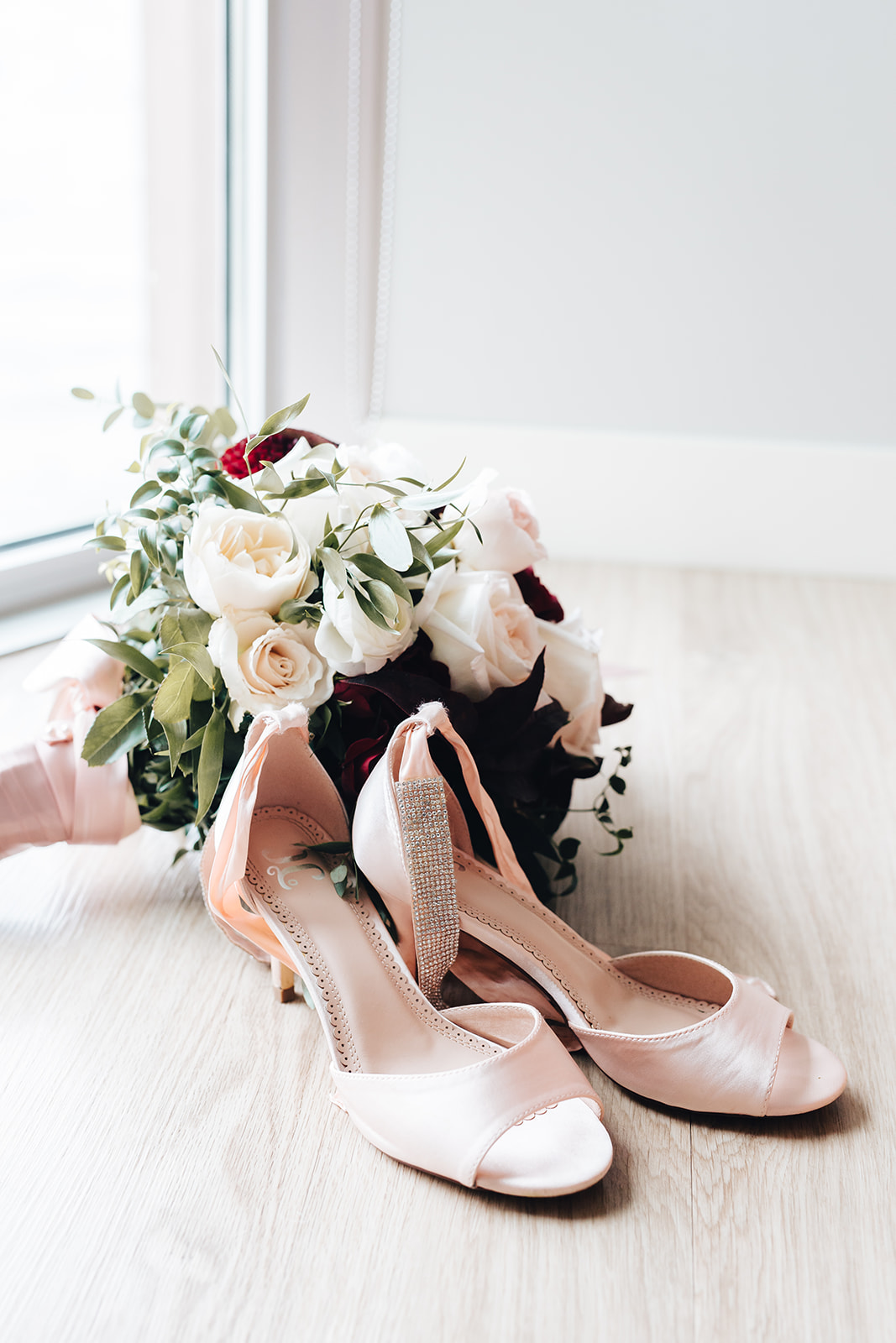 Bride's shoes and bouquet for West Bay Beach wedding