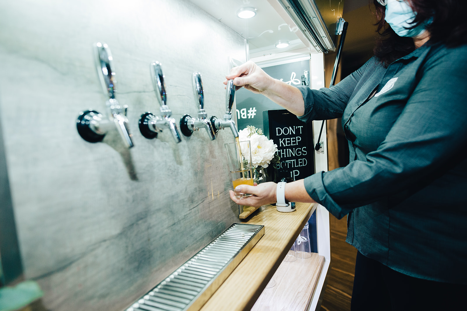 Cider being poured at West Bay Beach wedding