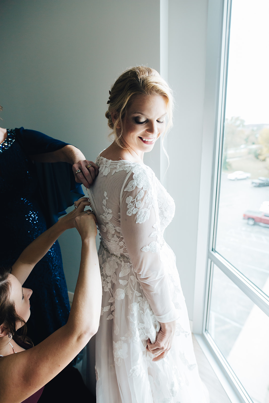 Bride smiling getting ready for her West Bay Beach wedding