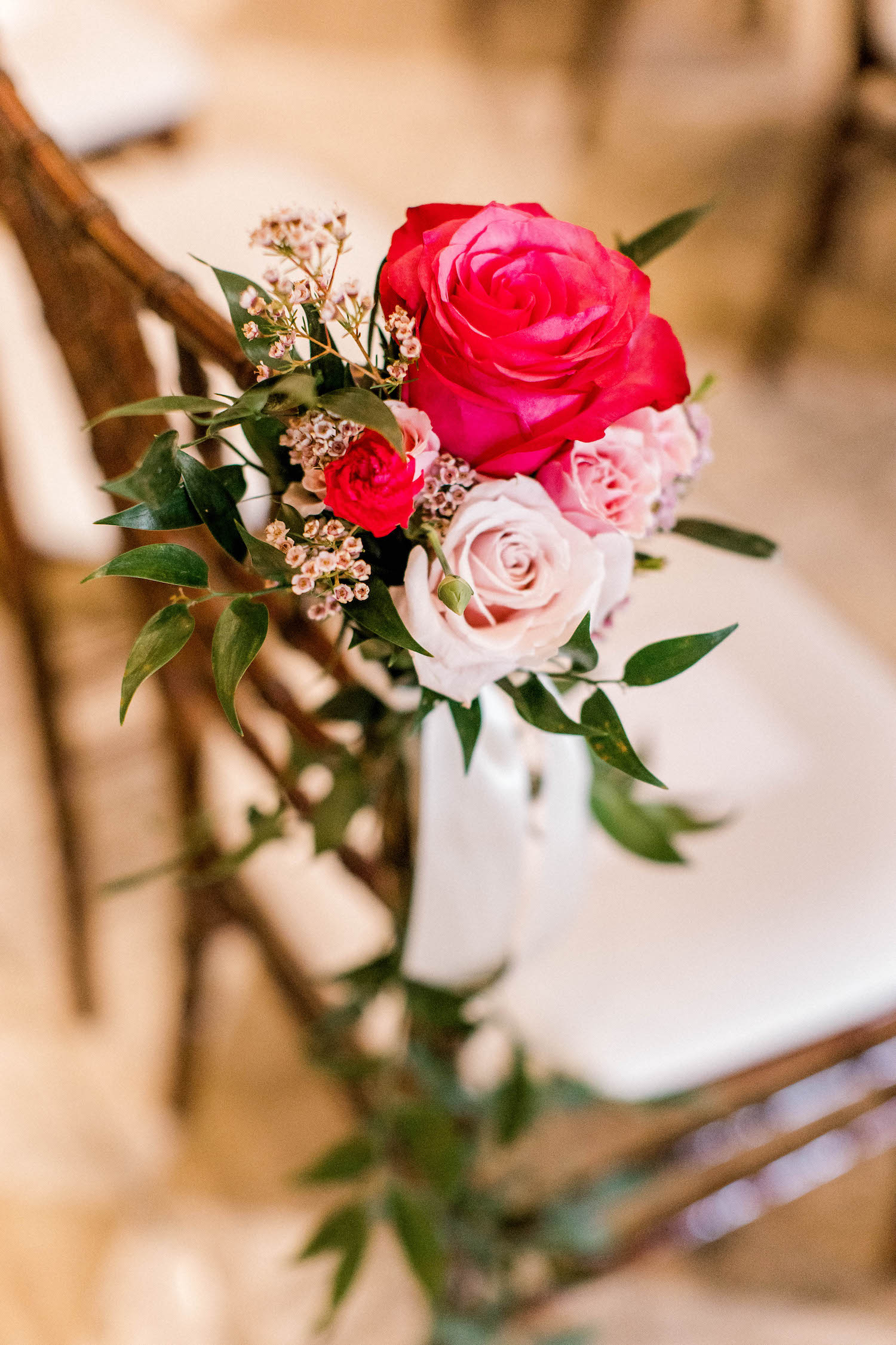 Pretty flowers on chair at City Flats Hotel wedding
