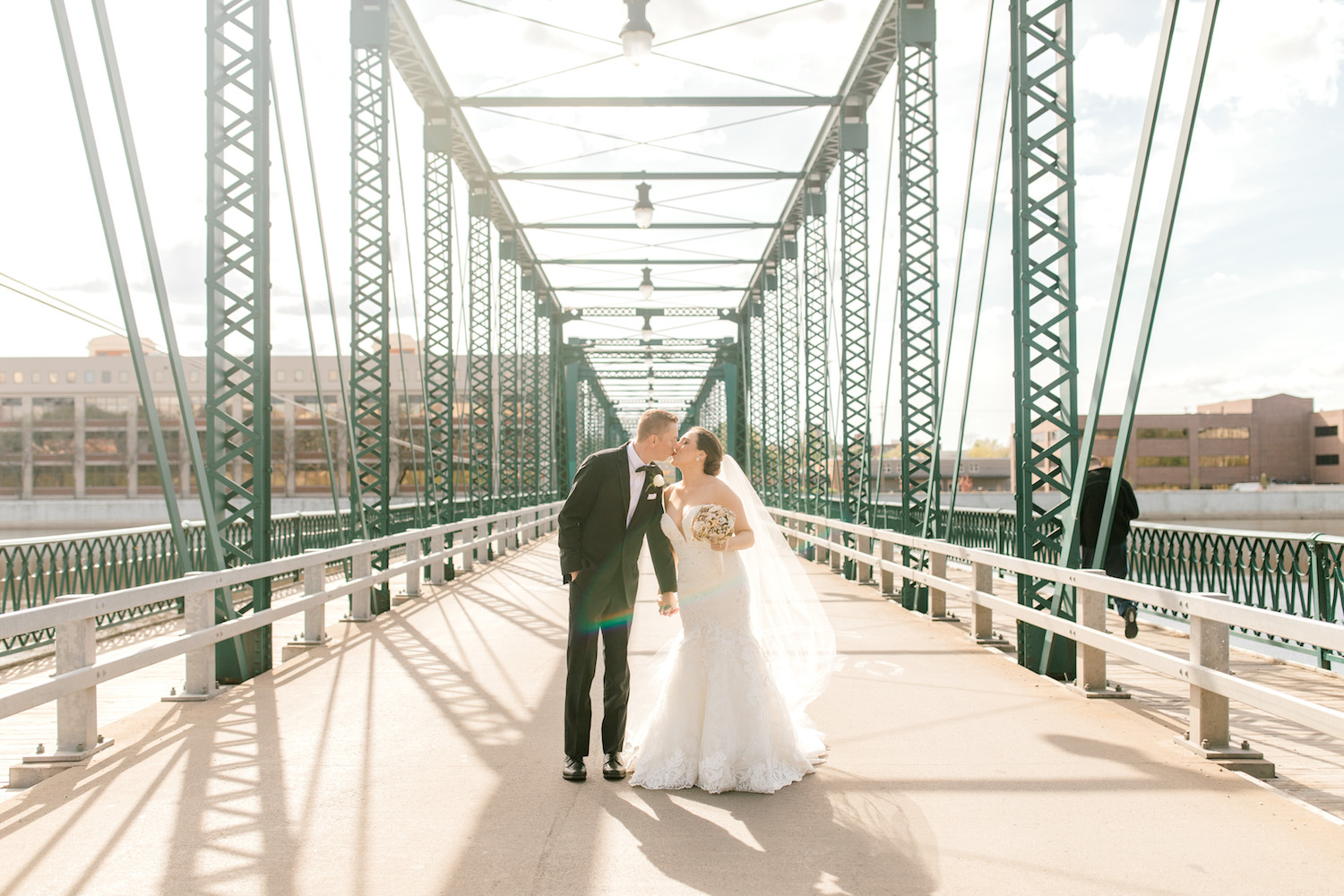 Bride and groom kissing on bride