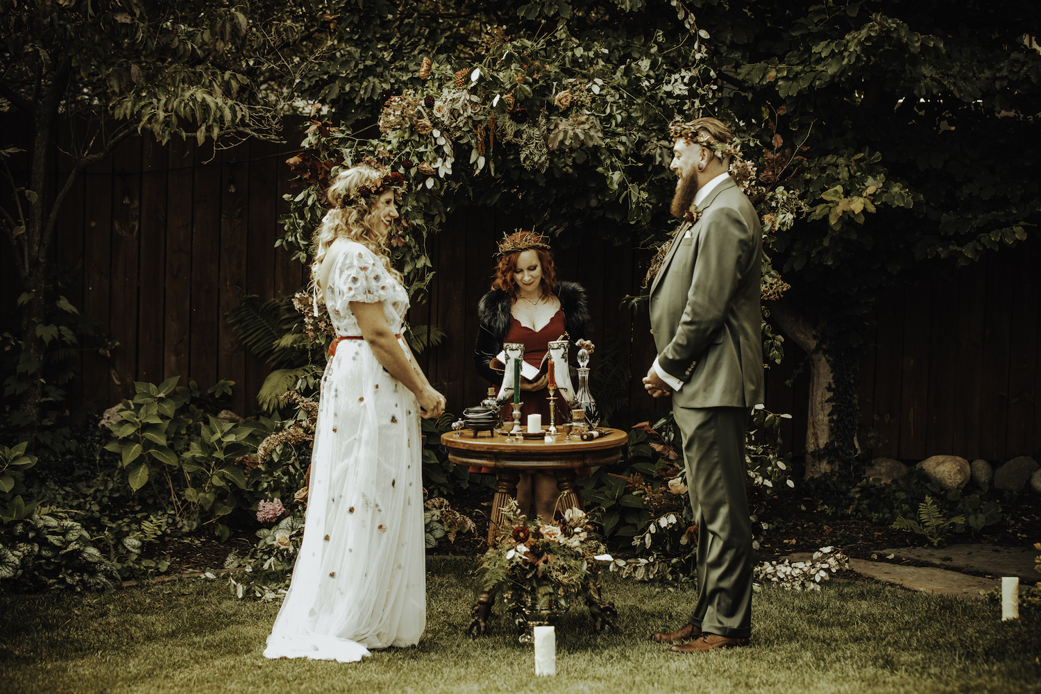 Bride and groom standing at alter of Grand Rapids Backyard wedding