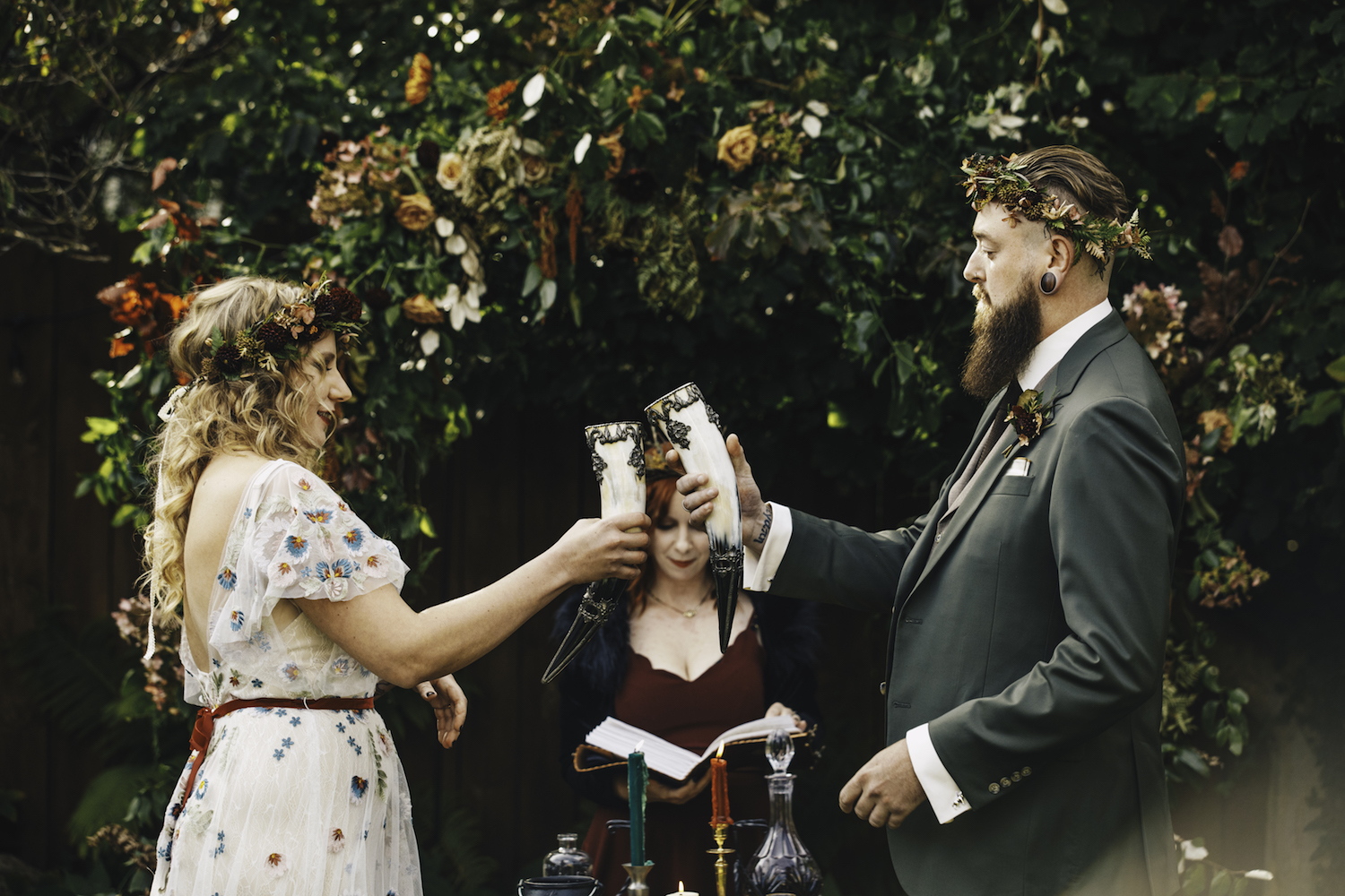 Bride and groom toasting to each other at alter