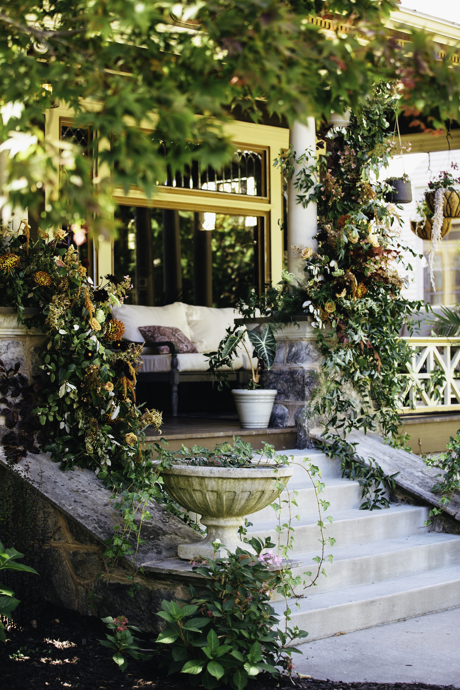 Floral decor on porch of Grand Rapids Backyard wedding