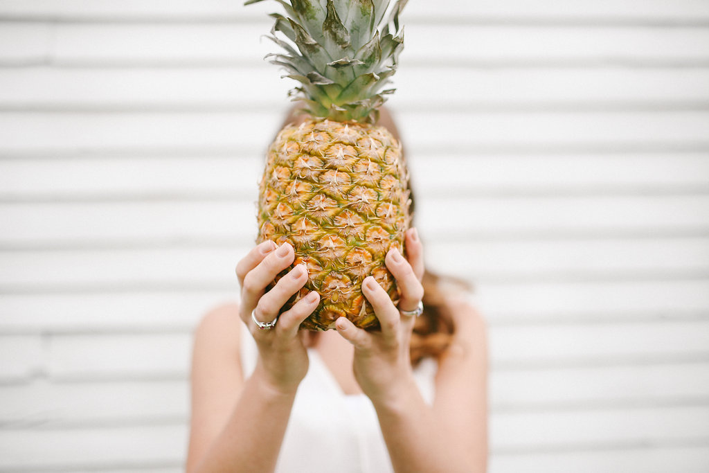 Girl with a pineapple sharing some of her favorite things