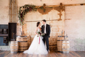 Couple smiling during a Journeyman Distillery wedding