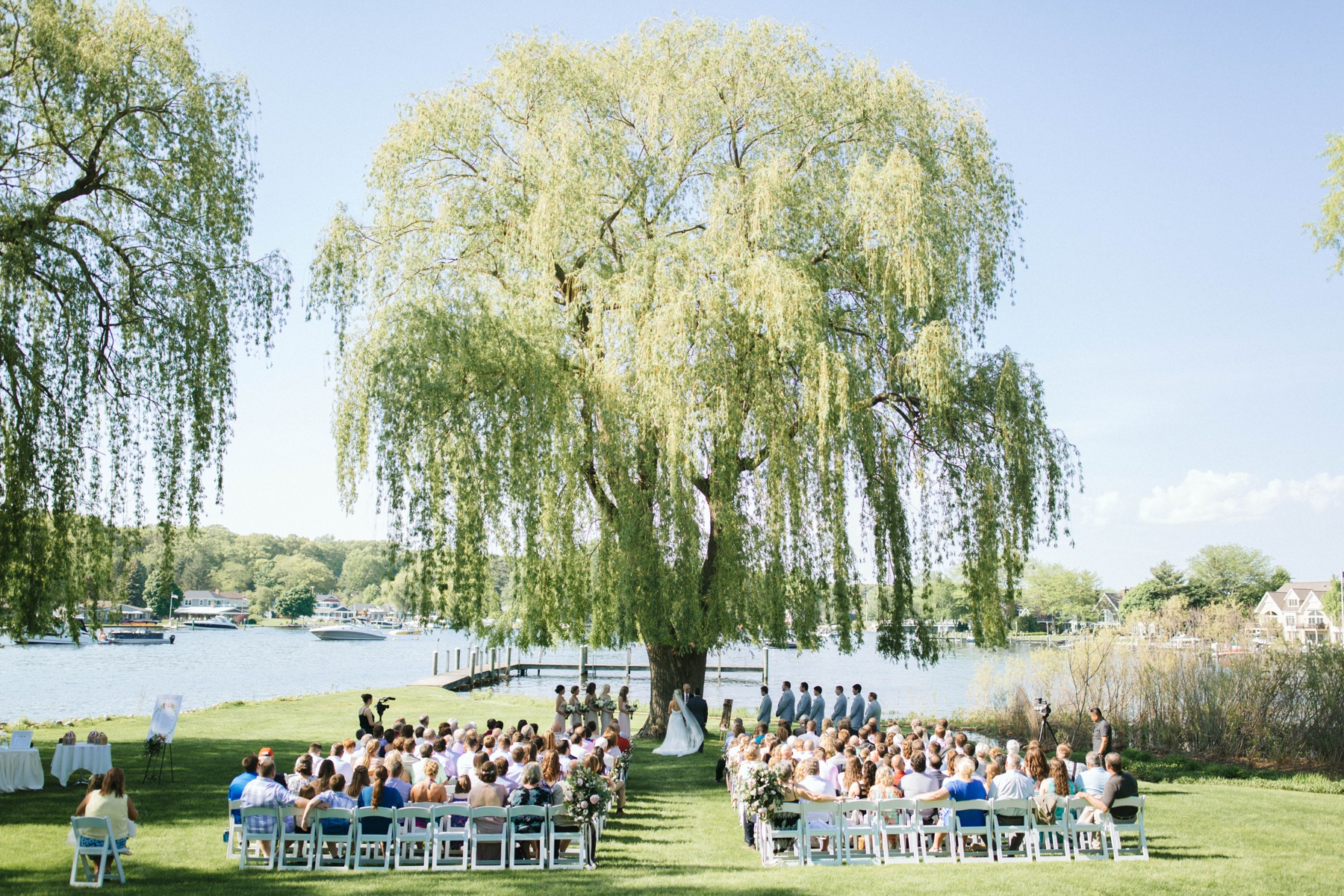 A ceremony happening during a spring lake country club wedding