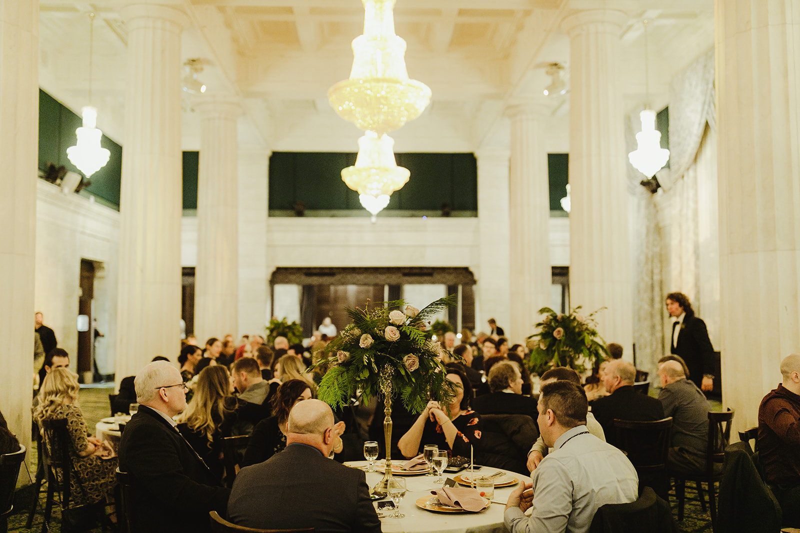 Guests enjoying dinner during a Ballroom at McKay wedding