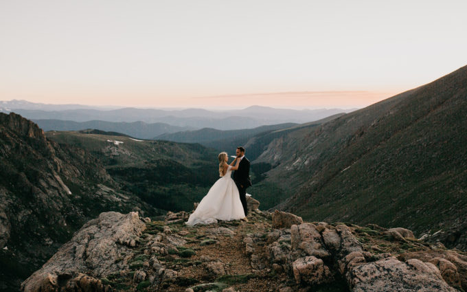 Couple enjoying the sunset during their rocky mountain wedding