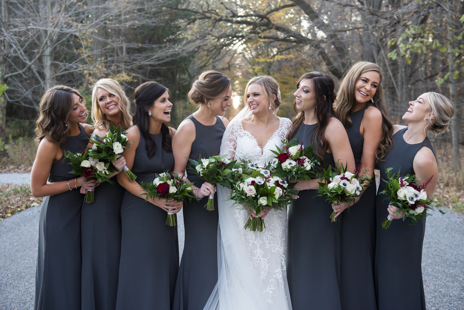 Bride and bridesmaids laughing