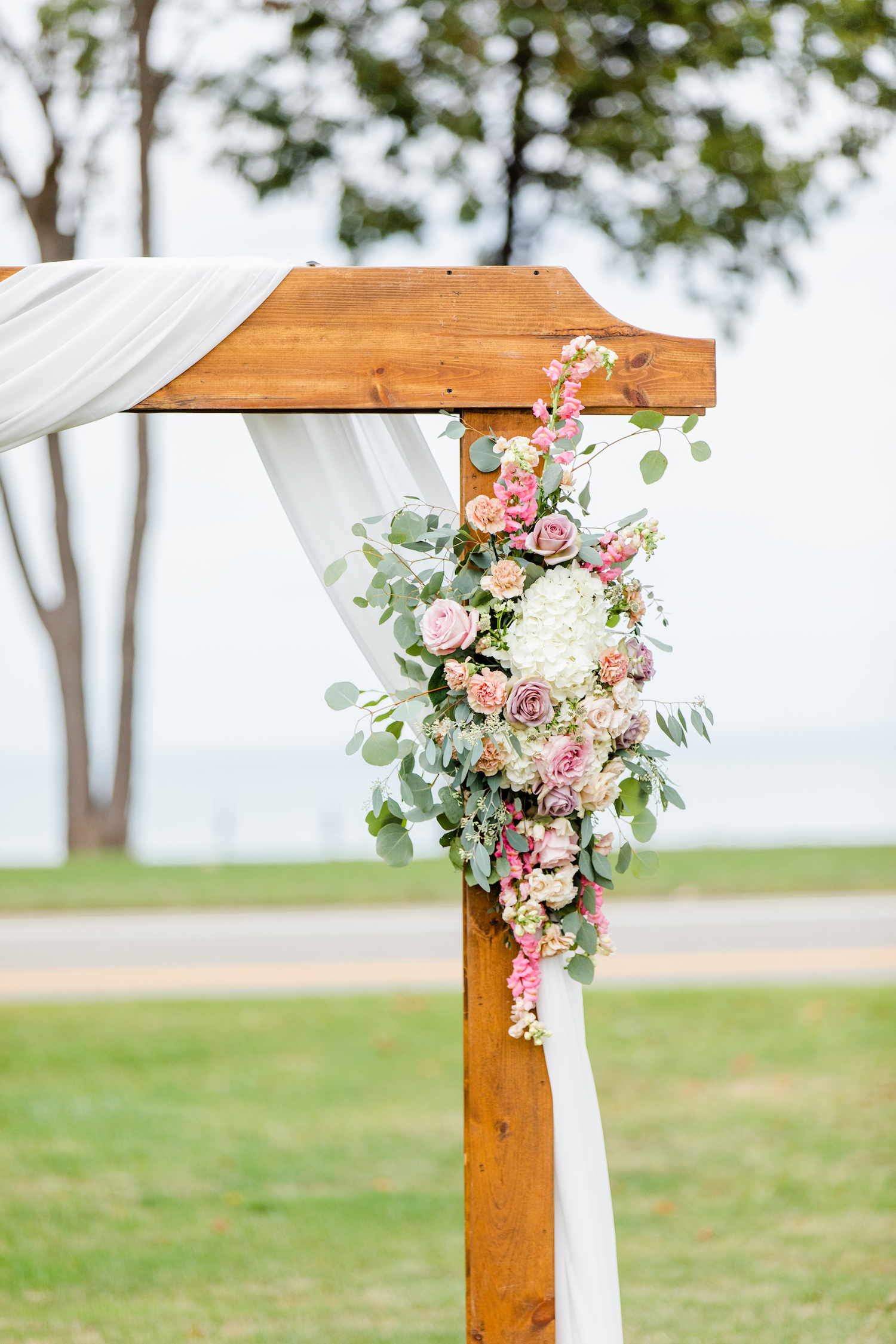 Flowers on arch for the lakehouse wedding